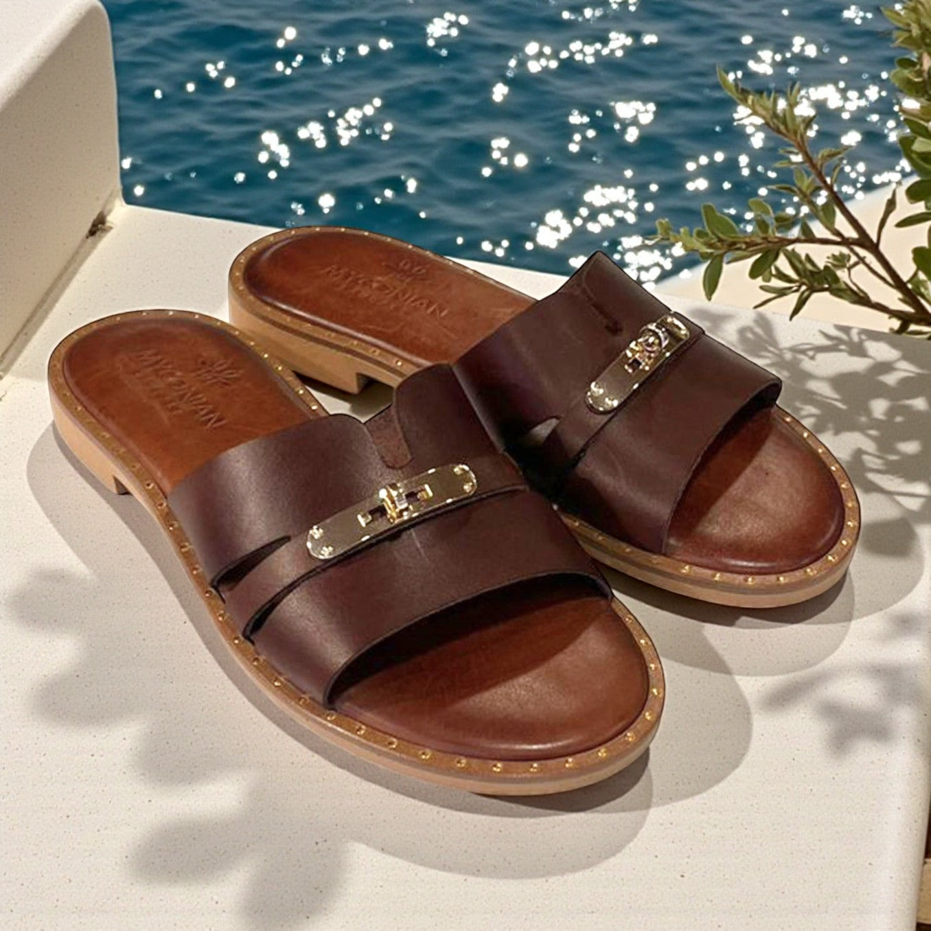 Cora brown leather flat mules with gold trim