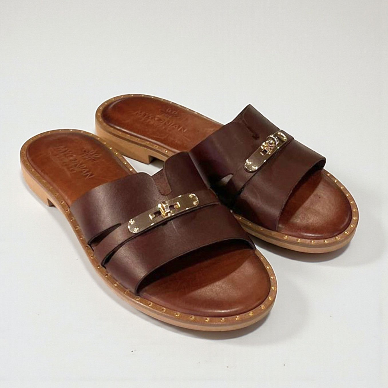Cora brown leather flat mules with gold trim