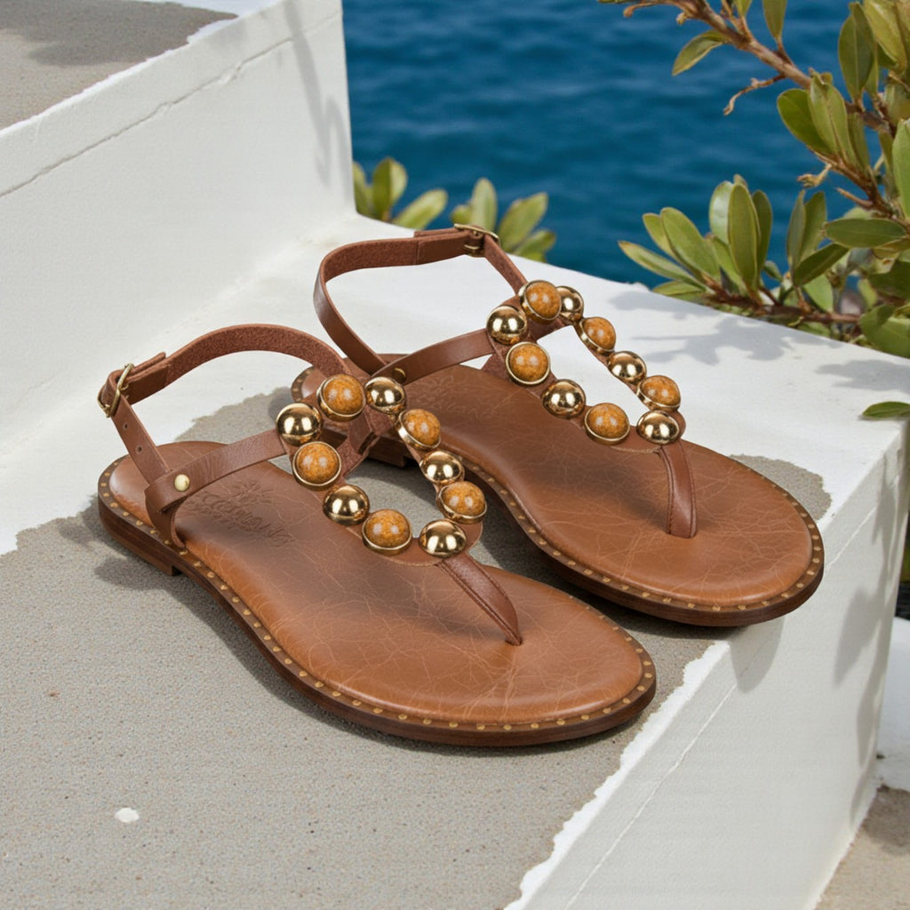 Naia tan leather Greek sandal with amber and gold stones