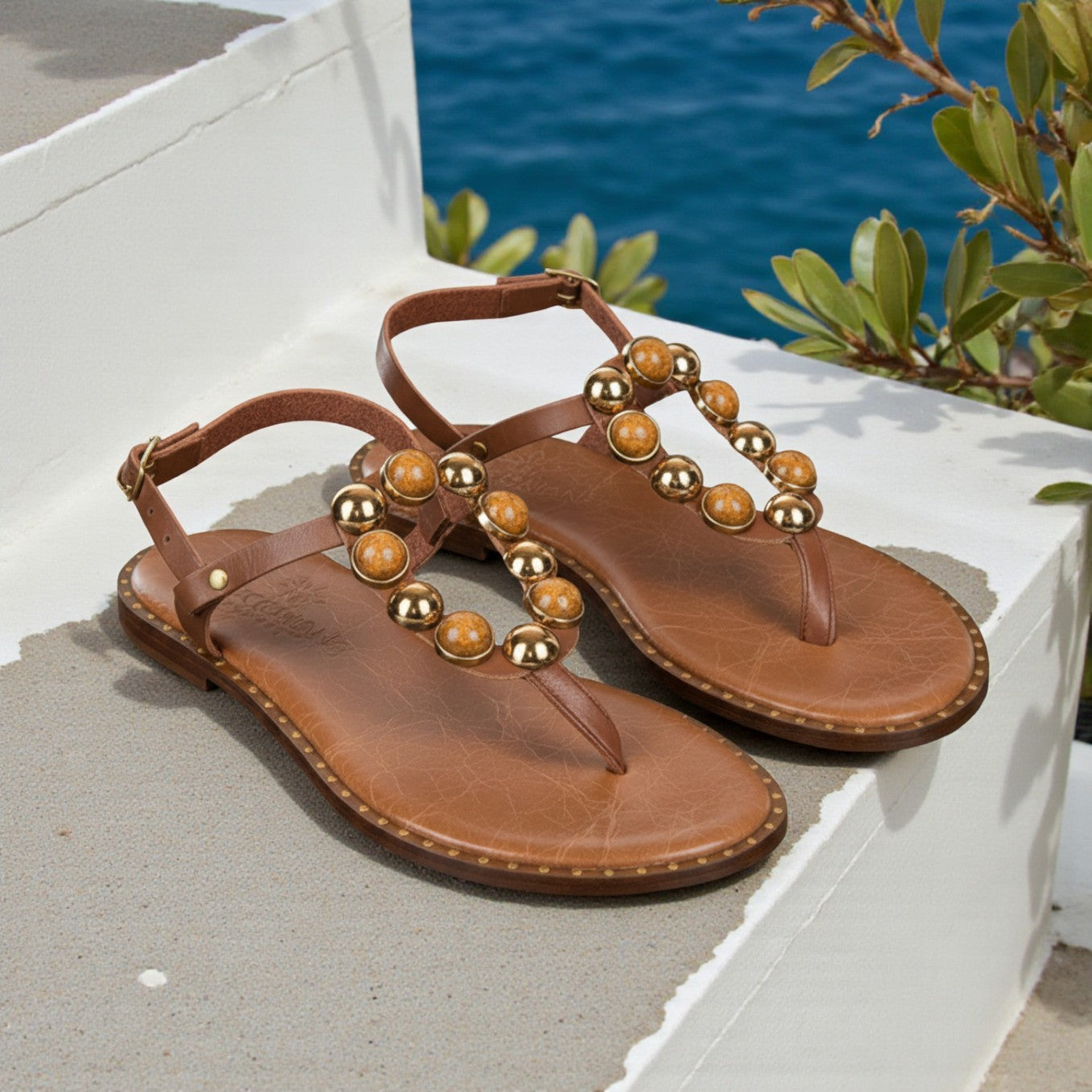 Naia tan leather Greek sandal with amber and gold stones