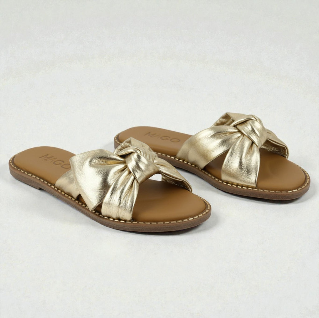 Yasmin gold leather flat sandal with knot detail
