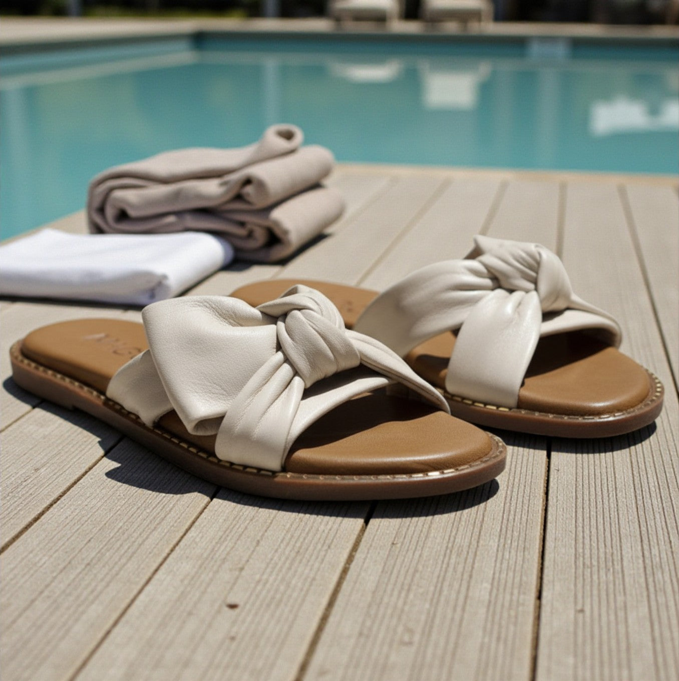 Yasmin off-white leather flat sandal with knot detail